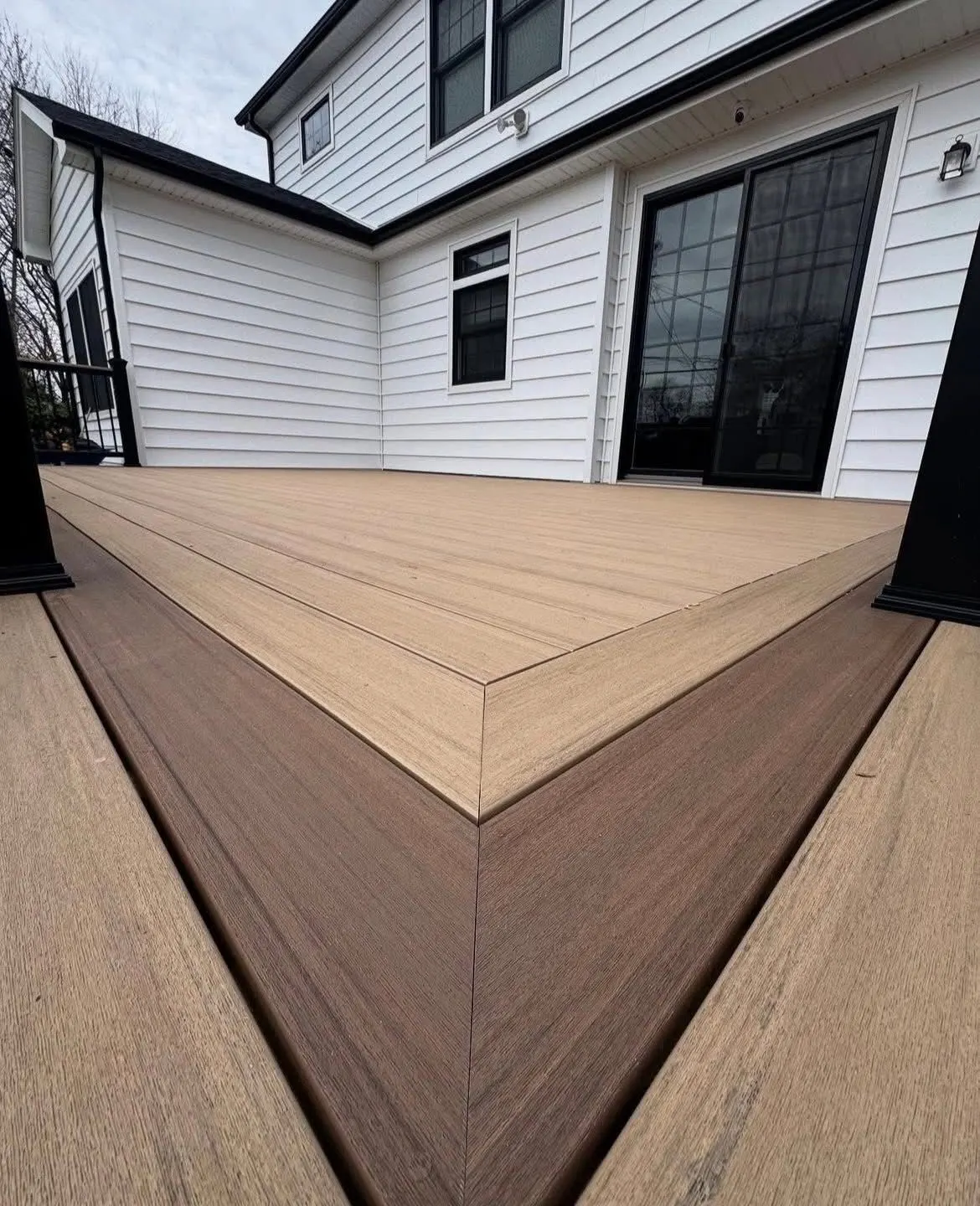 Close view of a mitred picture frame border on a composite deck